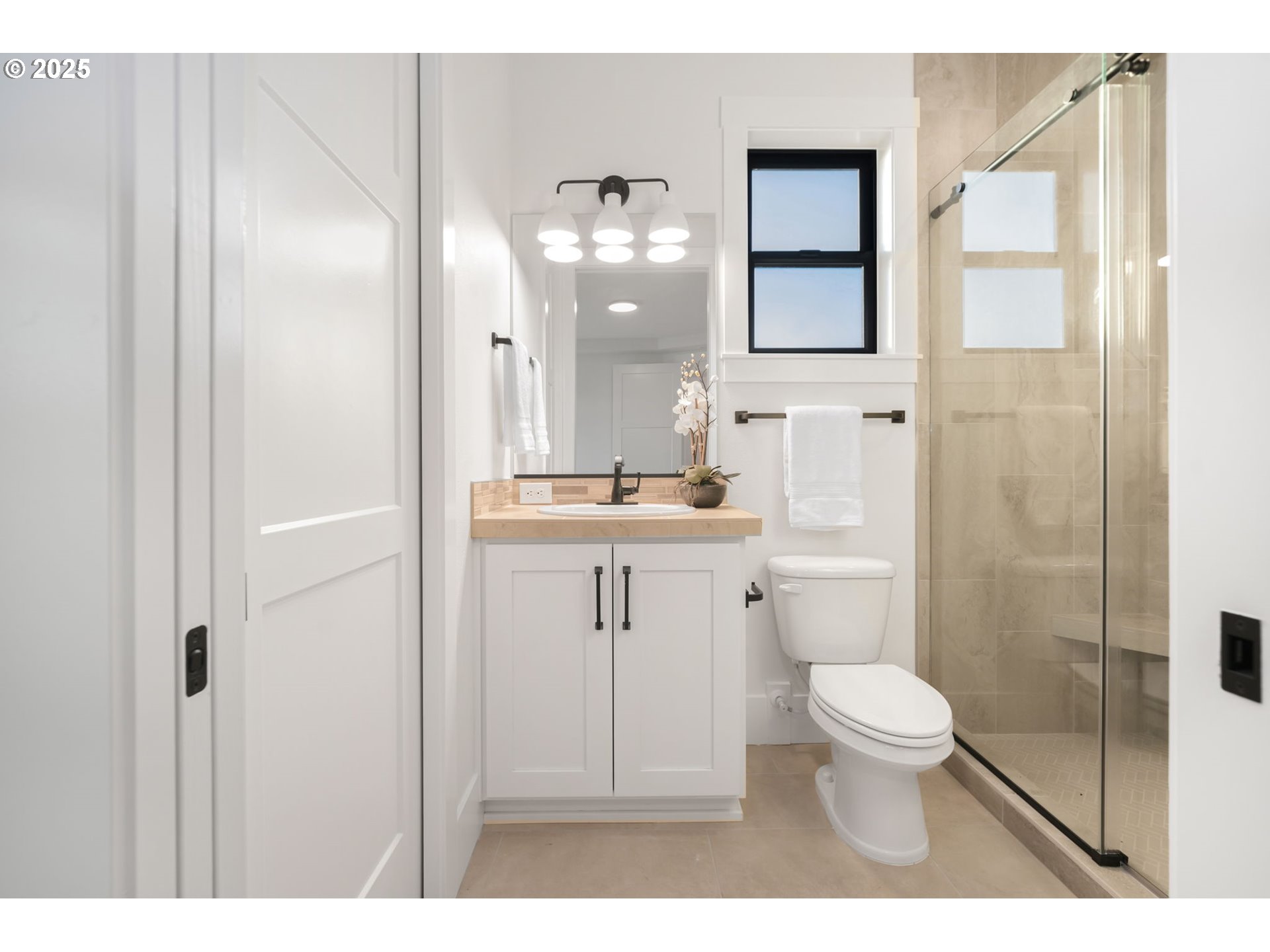 818 Northwest 173rd Street Ridgefield, WA 98642 - Photo 24 of 44 a bathroom with a sink a toilet and shower
