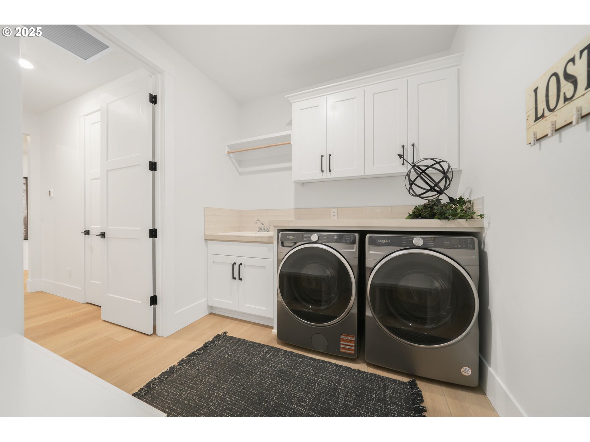 818 Northwest 173rd Street Ridgefield, WA 98642 - Photo 37 of 44 a utility room with sink dryer and washer