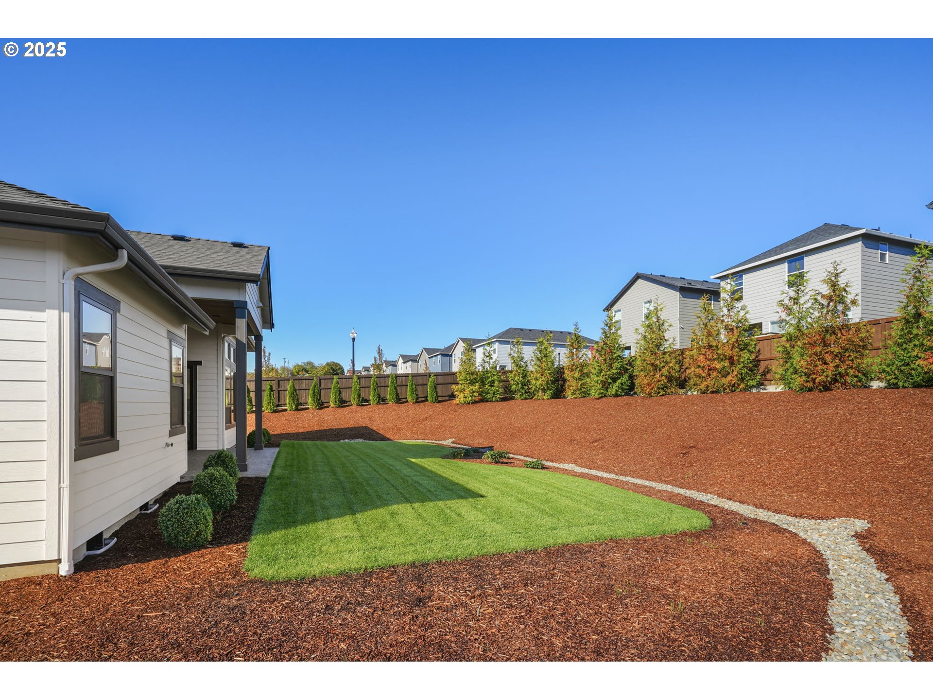 818 Northwest 173rd Street Ridgefield, WA 98642 - Photo 40 of 44 a view of a house with a yard