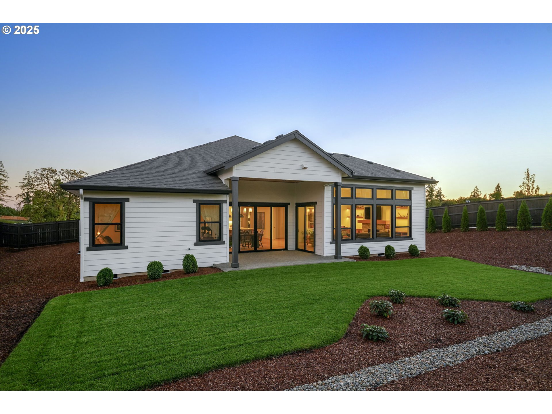 818 Northwest 173rd Street Ridgefield, WA 98642 - Photo 4 of 44 a front view of a house with a yard and garage