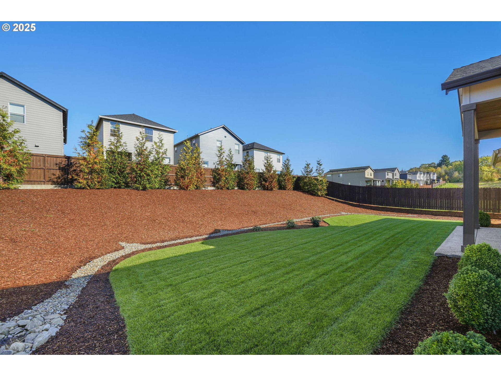 818 Northwest 173rd Street Ridgefield, WA 98642 - Photo 41 of 44 a view of a house with a yard and table