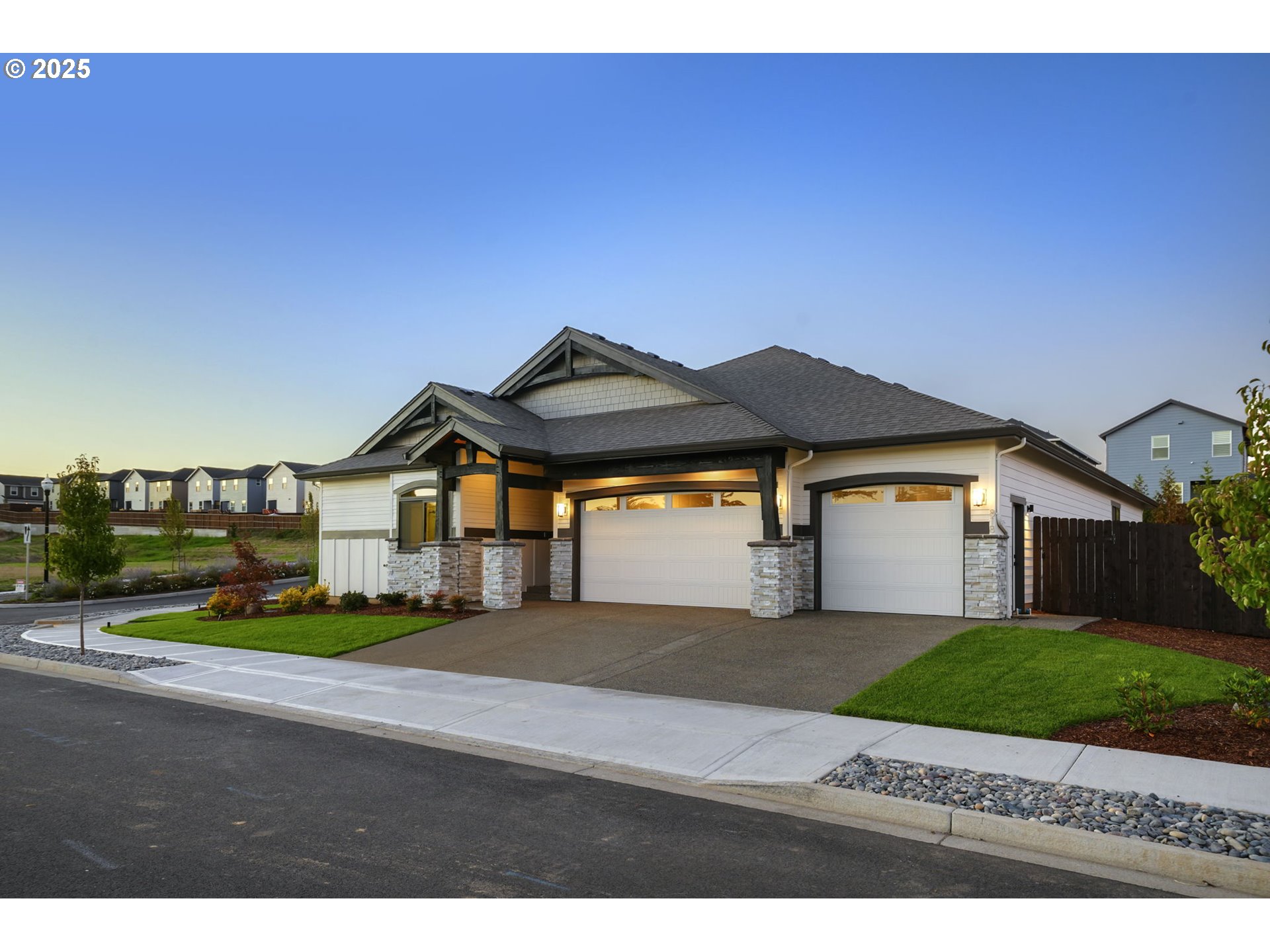 818 Northwest 173rd Street Ridgefield, WA 98642 - Photo 43 of 44 a front view of a house with a yard and garage