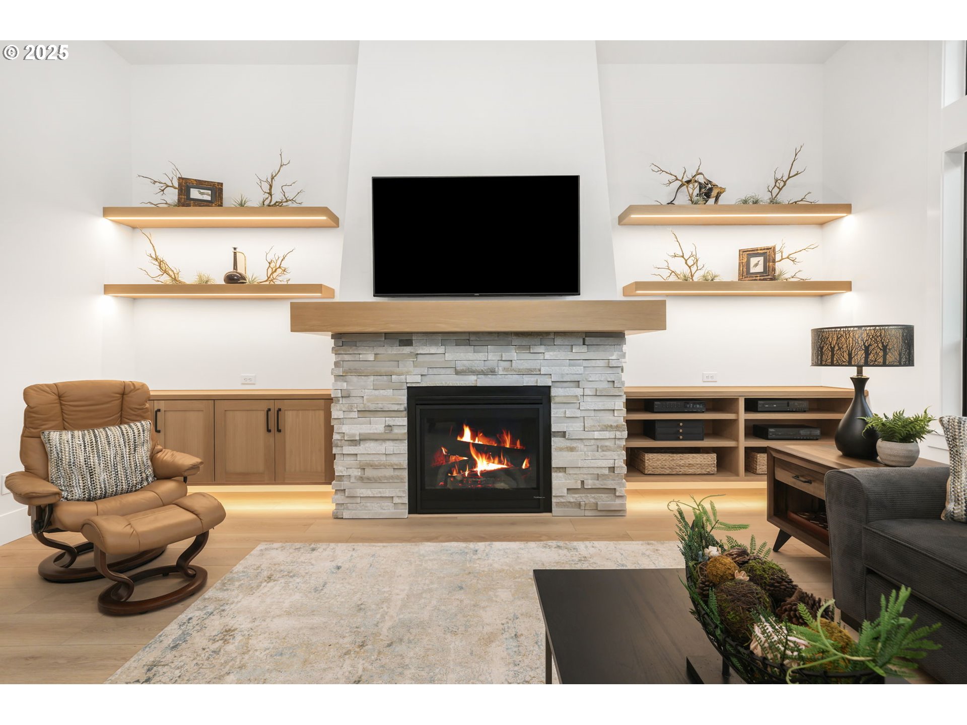 818 Northwest 173rd Street Ridgefield, WA 98642 - Photo 9 of 44 a living room with furniture a flat screen tv and a fireplace