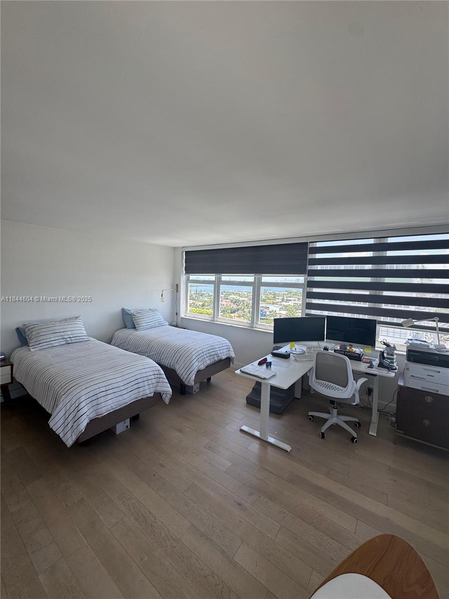 2150 Sans Souci Boulevard, Unit B1611 North Miami, FL 33181 - Photo 11 of 21 a bedroom with bed couch and window