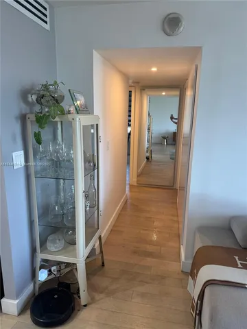 a bedroom with bed couch and window