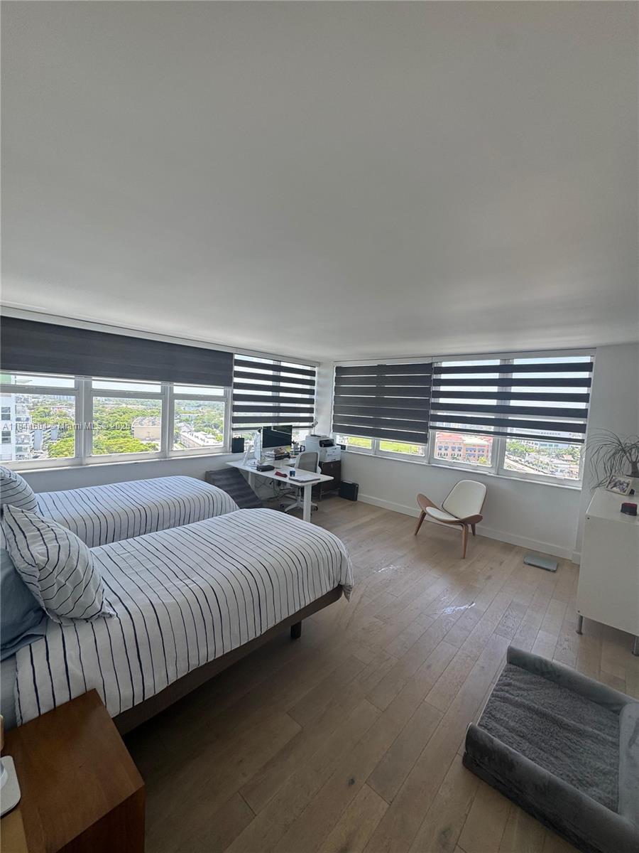 2150 Sans Souci Boulevard, Unit B1611 North Miami, FL 33181 - Photo 10 of 21 a bedroom with bed couch and window