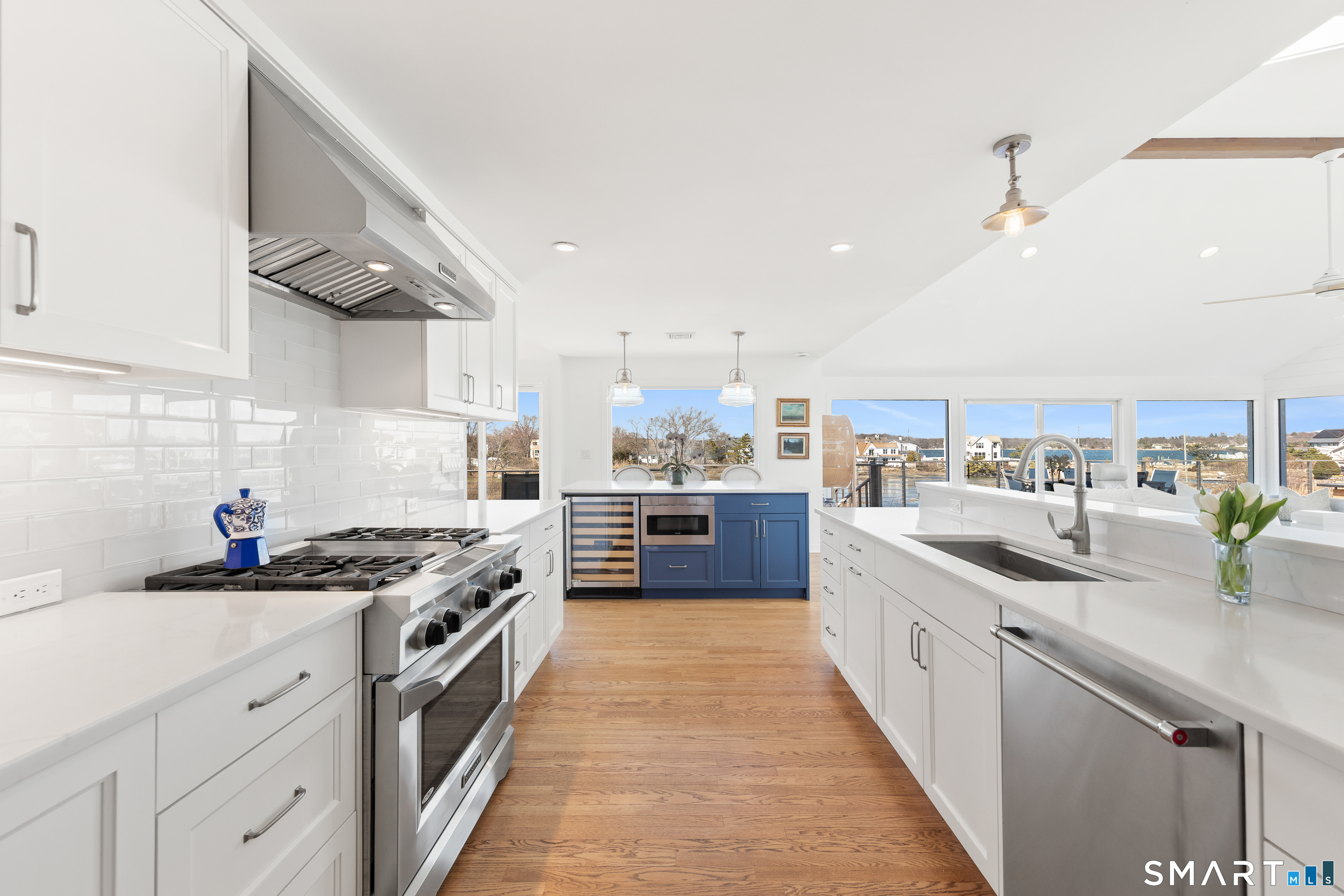 9 Marsh Road Westport, CT 06880 - Photo 11 of 39 a kitchen with stainless steel appliances a sink stove and cabinets