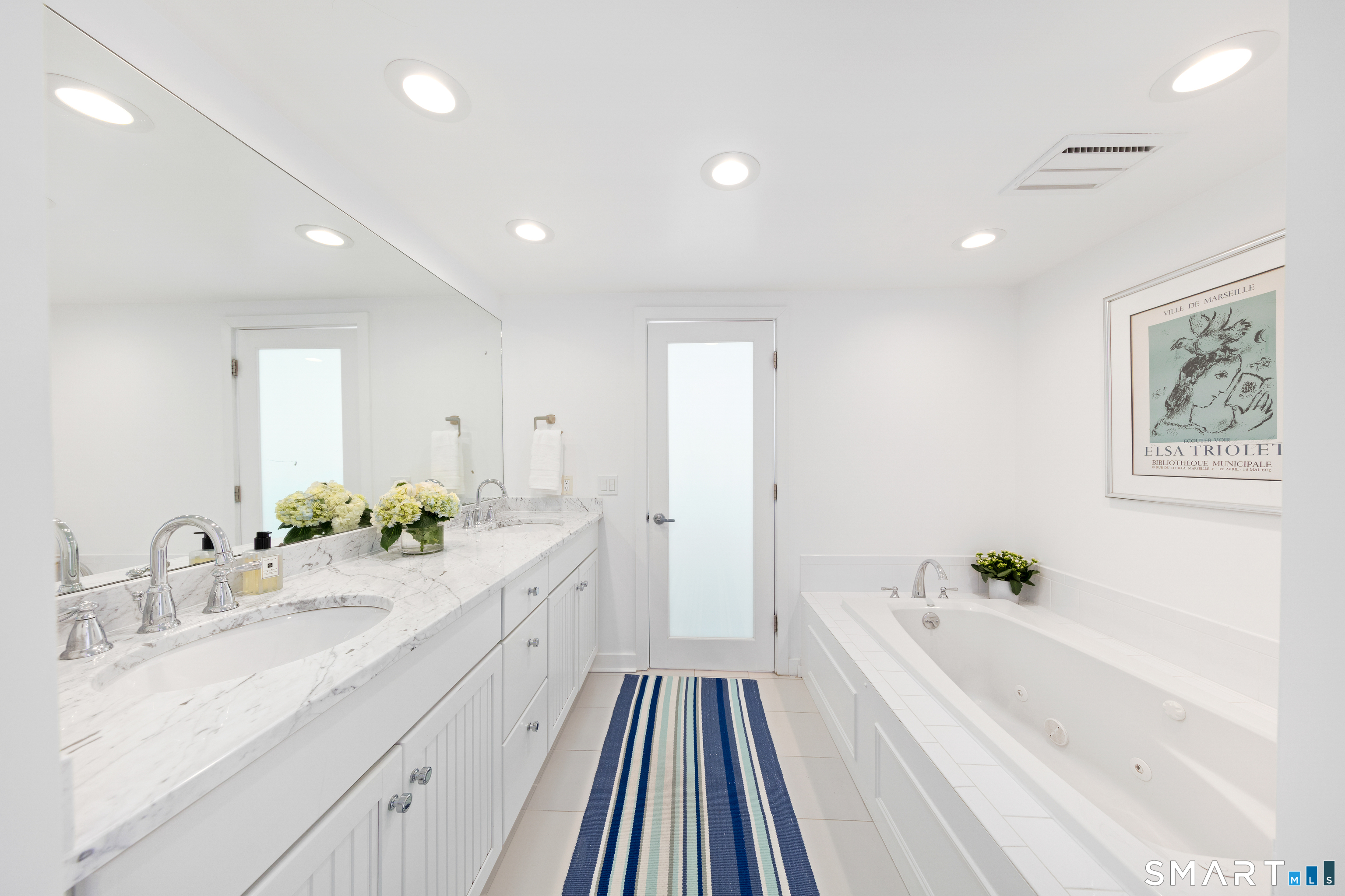 9 Marsh Road Westport, CT 06880 - Photo 24 of 39 a spacious bathroom with a double vanity sink and a bathtub