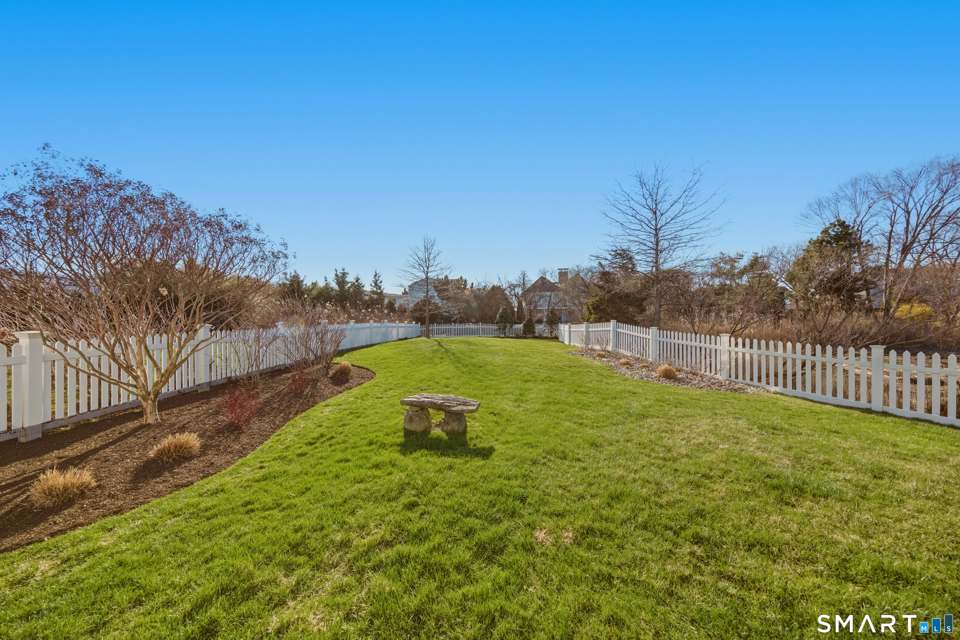 9 Marsh Road Westport, CT 06880 - Photo 31 of 39 a view of a backyard with a garden