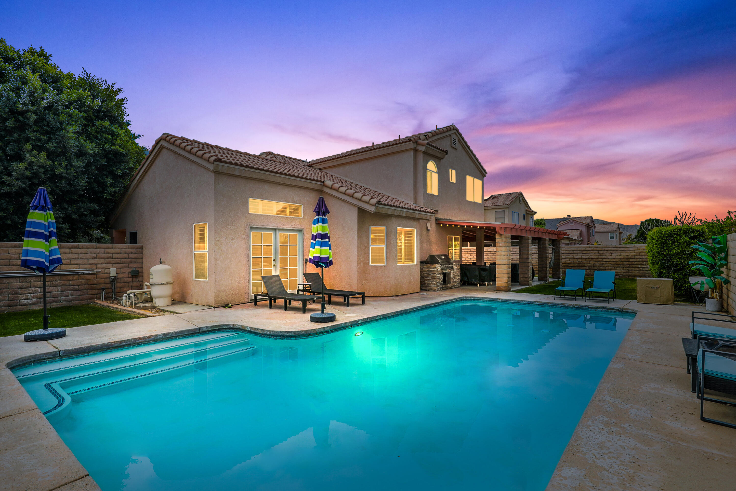 a front view of house with yard and outdoor seating