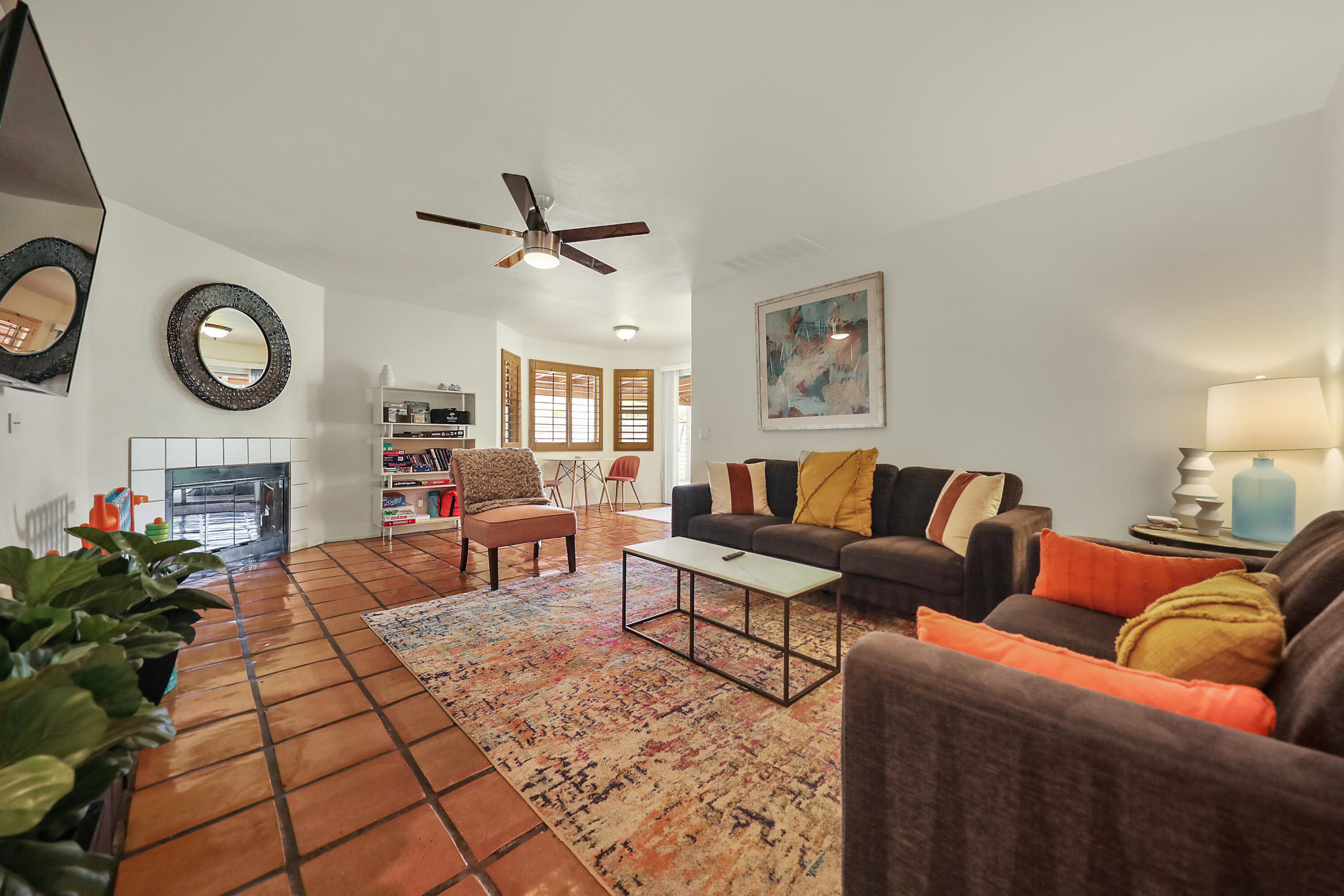 80380 Paseo Encanto Indio, CA 92201 - Photo 13 of 32 a living room with furniture a clock and a flat screen tv