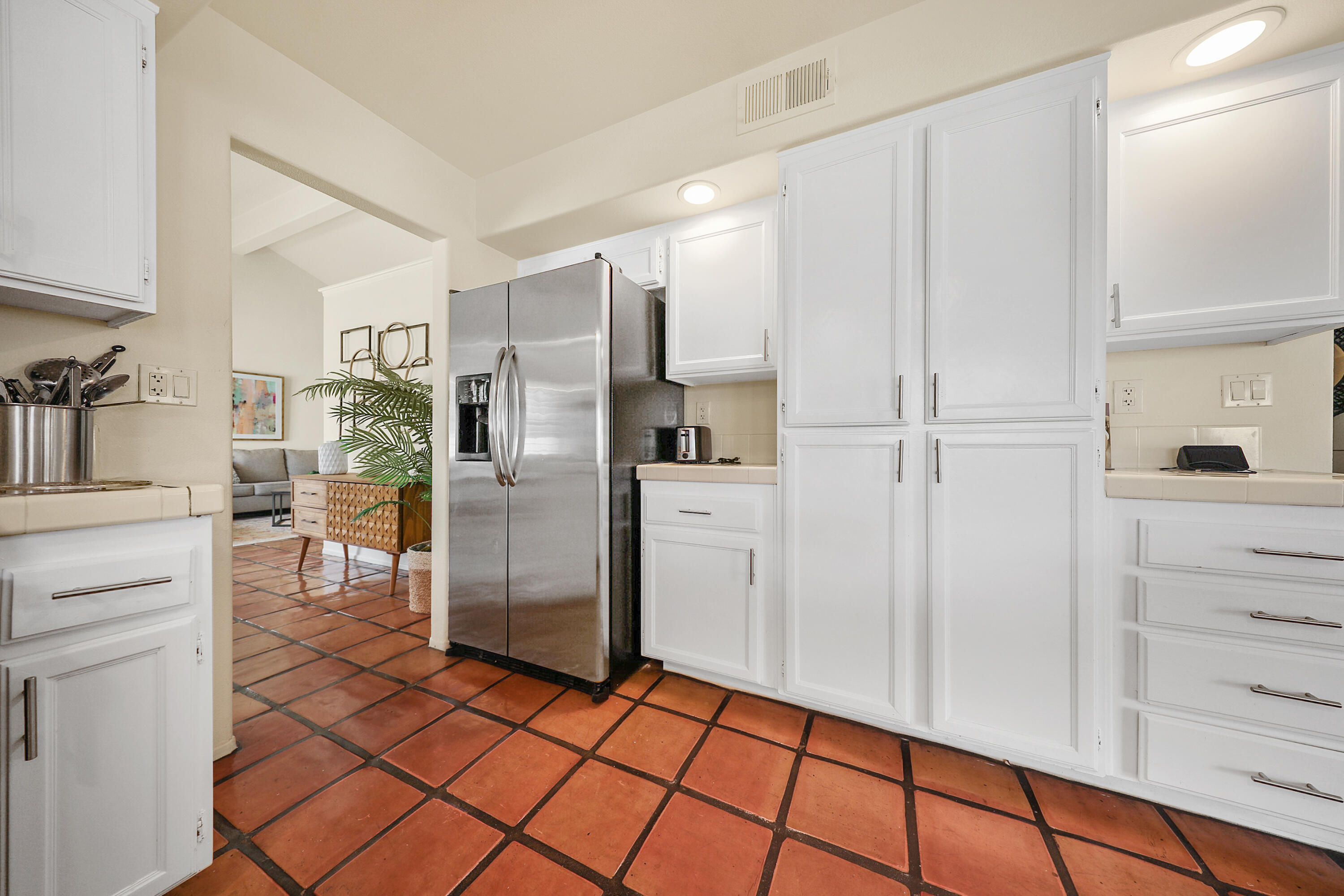 80380 Paseo Encanto Indio, CA 92201 - Photo 15 of 32 a kitchen with stainless steel appliances a refrigerator and cabinets