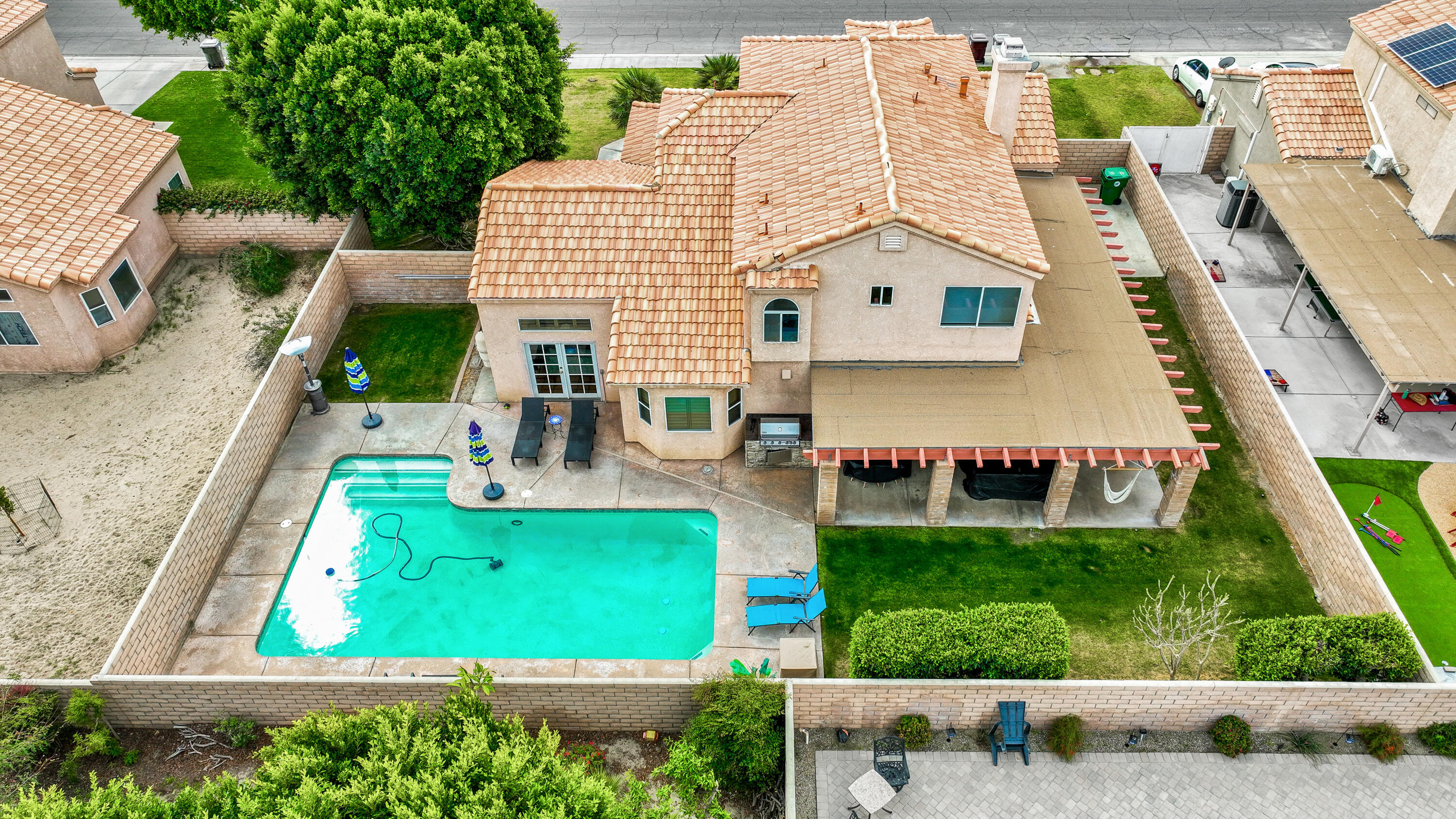80380 Paseo Encanto Indio, CA 92201 - Photo 2 of 32 a view of house with backyard outdoor seating and swimming pool