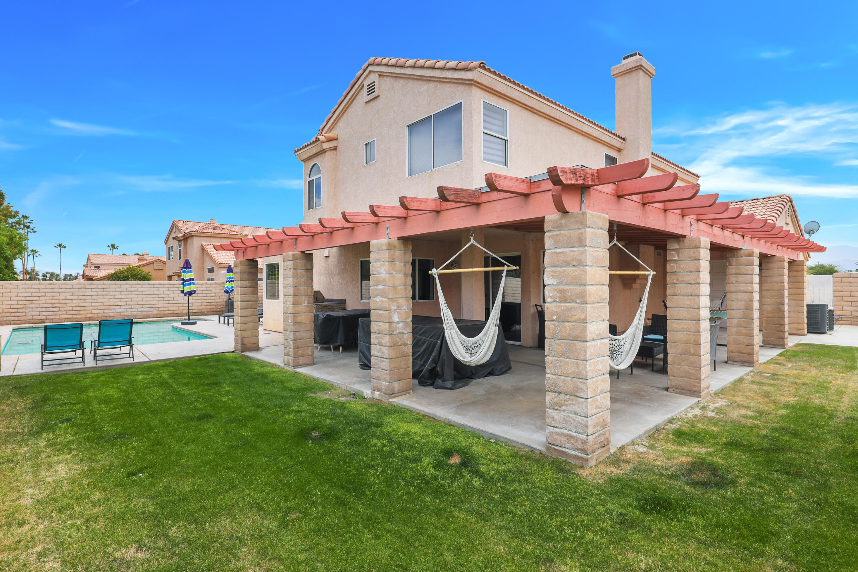 80380 Paseo Encanto Indio, CA 92201 - Photo 28 of 32 a front view of a house with a yard