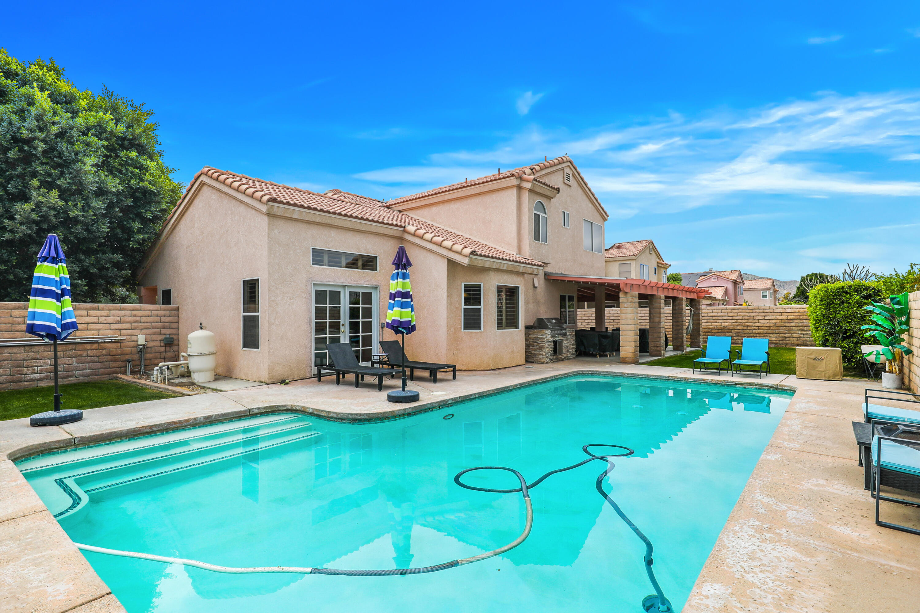 80380 Paseo Encanto Indio, CA 92201 - Photo 30 of 32 a view of a house with backyard porch and sitting area