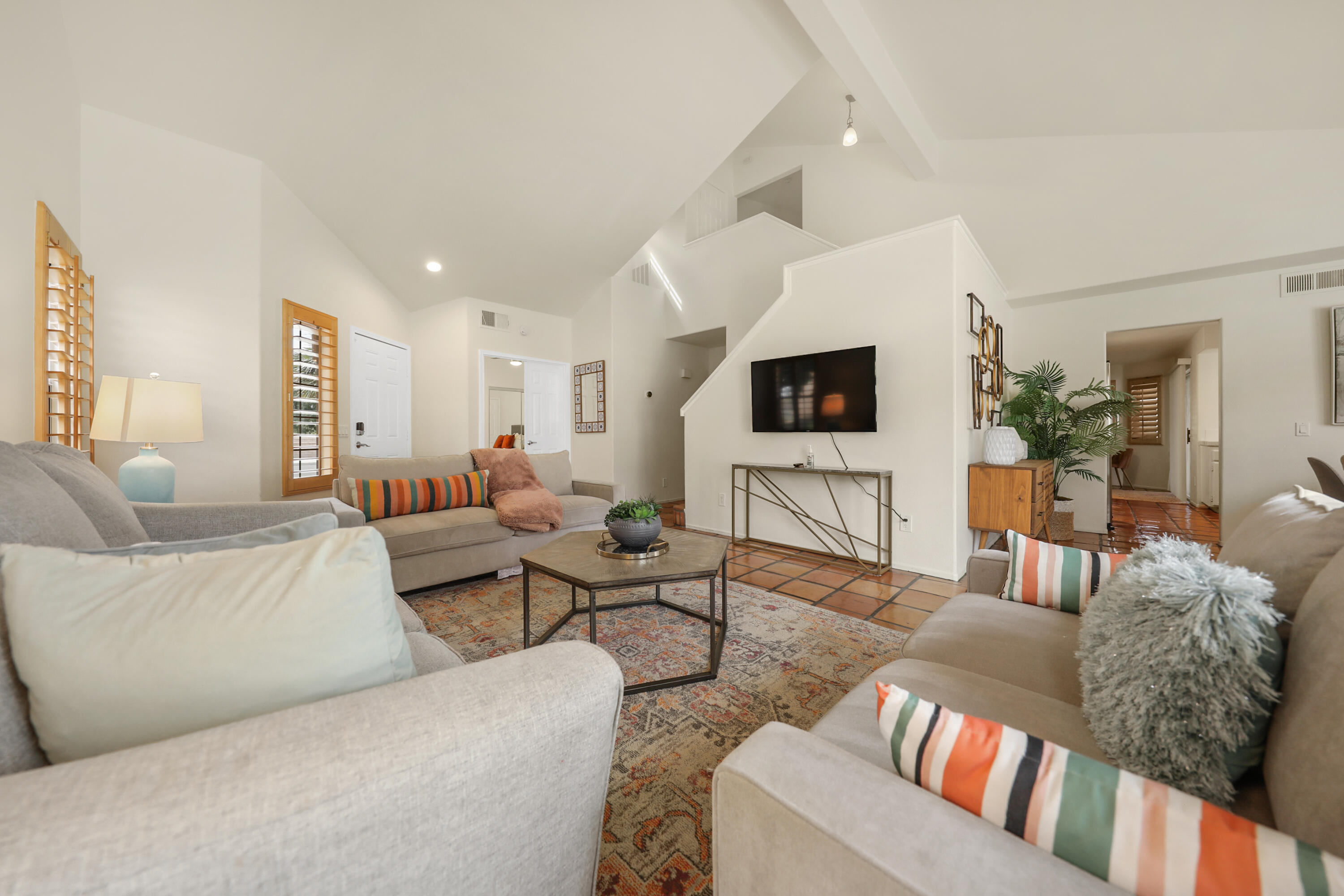 80380 Paseo Encanto Indio, CA 92201 - Photo 3 of 32 a living room with furniture and a flat screen tv