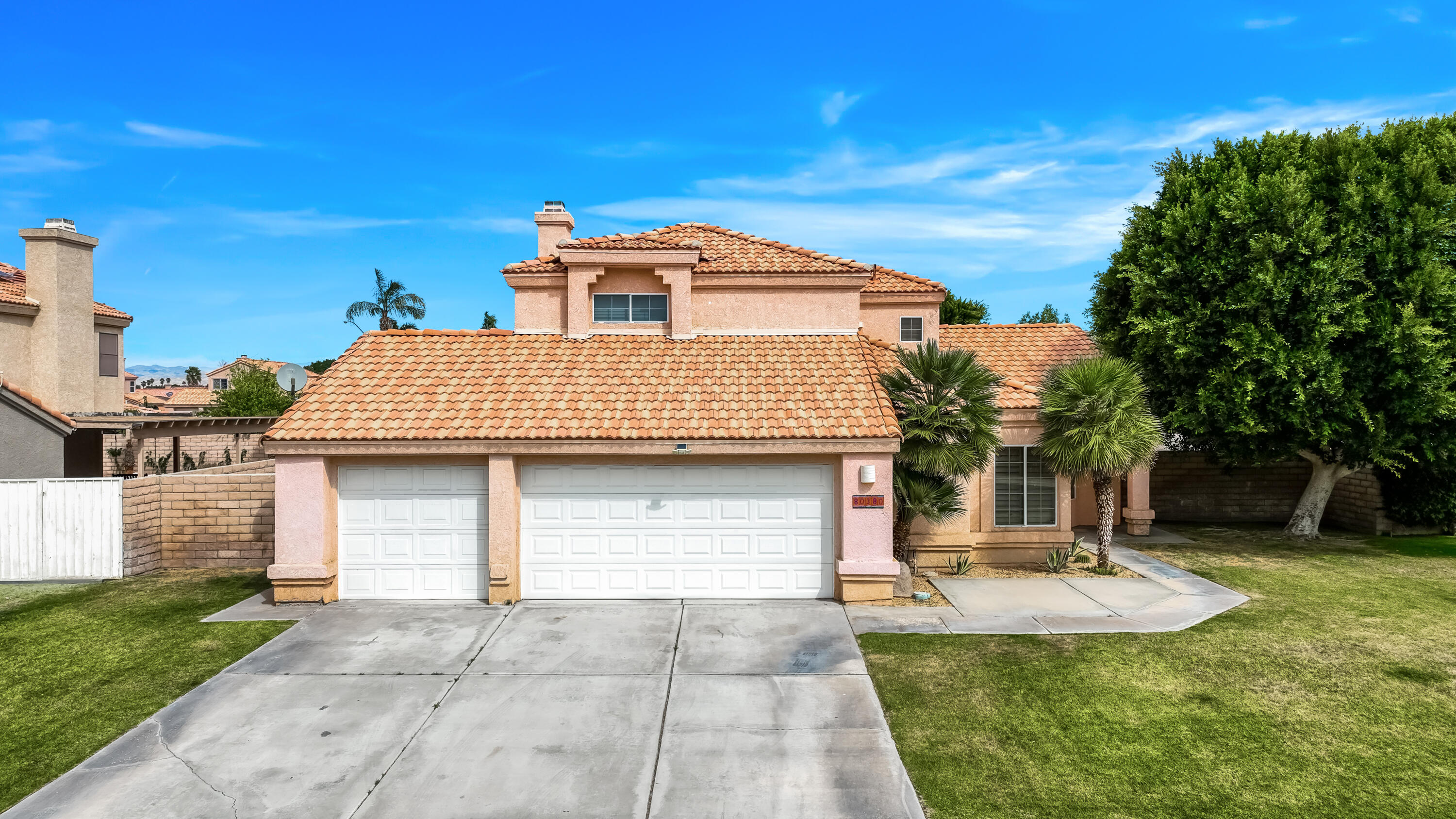 80380 Paseo Encanto Indio, CA 92201 - Photo 5 of 32 a front view of a house with a yard