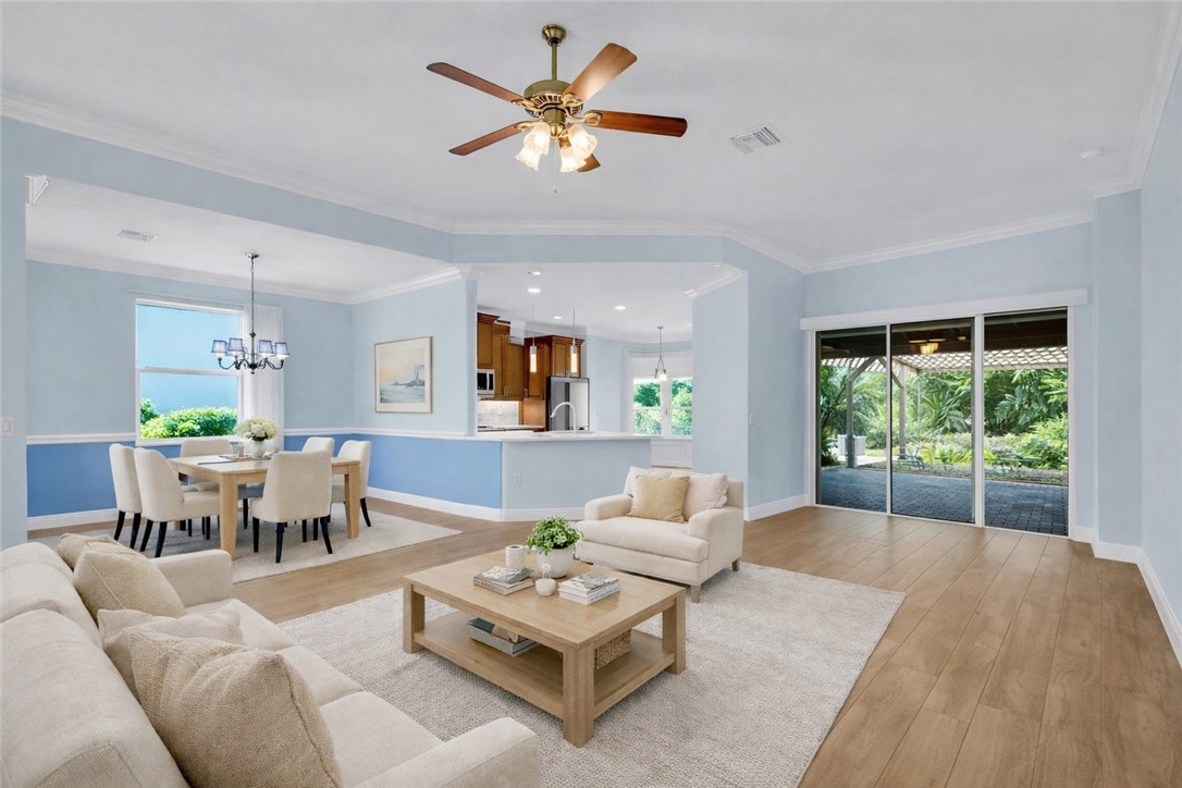 239 11th Square Southwest Vero Beach, FL 32962 - Photo 12 of 36 a living room with furniture and a large window