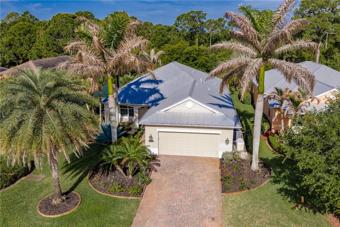 239 11th Square Southwest Vero Beach, FL 32962 - Photo 2 of 36 a front view of a house with garden