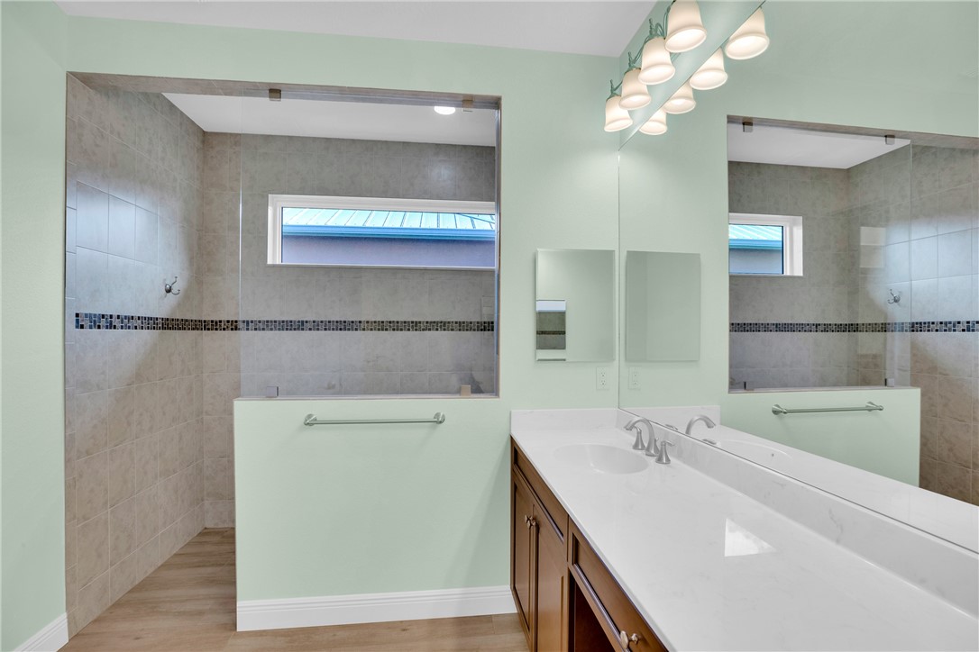 239 11th Square Southwest Vero Beach, FL 32962 - Photo 25 of 36 a bathroom with a sink a vanity and a mirror