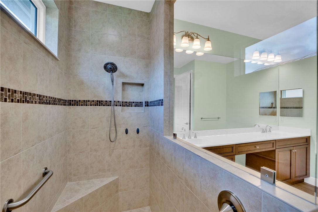 239 11th Square Southwest Vero Beach, FL 32962 - Photo 26 of 36 a bathroom with a tub sink and mirror