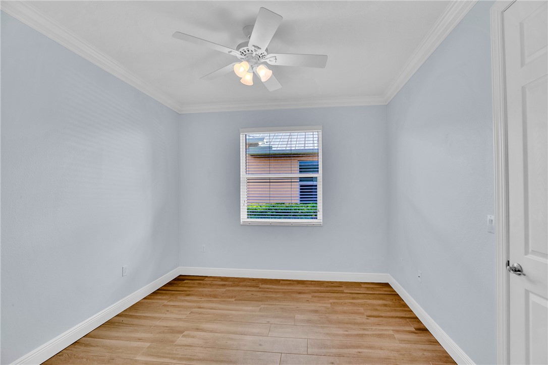 239 11th Square Southwest Vero Beach, FL 32962 - Photo 29 of 36 a view of an empty room with wooden floor and fan