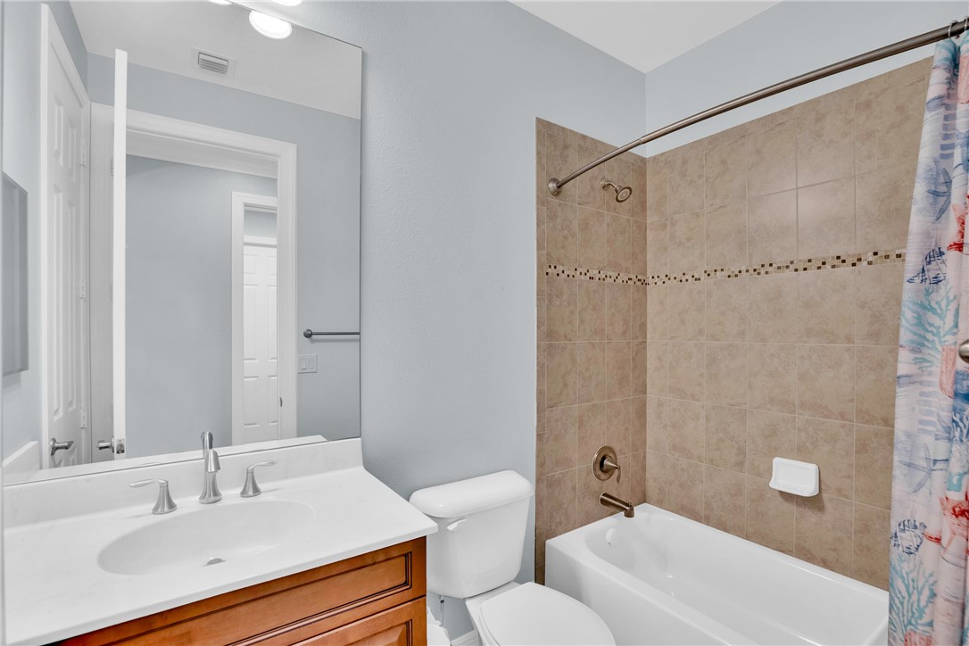 239 11th Square Southwest Vero Beach, FL 32962 - Photo 30 of 36 a bathroom with a sink and a mirror