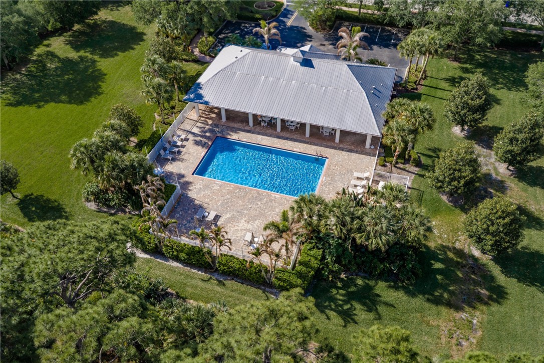 239 11th Square Southwest Vero Beach, FL 32962 - Photo 36 of 36 an aerial view of a house with a yard and lake view