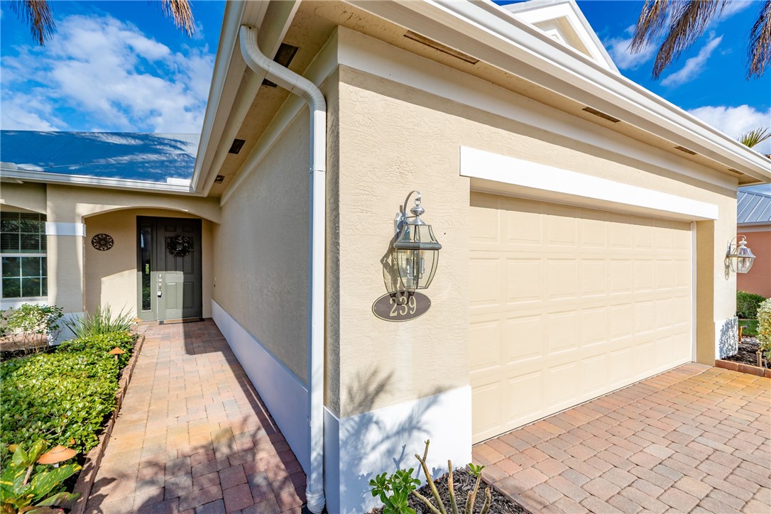 239 11th Square Southwest Vero Beach, FL 32962 - Photo 4 of 36 a front view of a house with white walls