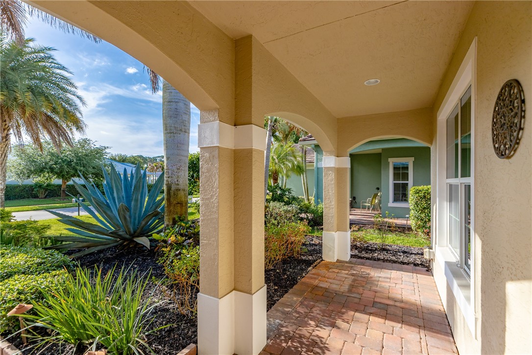 239 11th Square Southwest Vero Beach, FL 32962 - Photo 6 of 36 a view of a house with a yard and potted plants