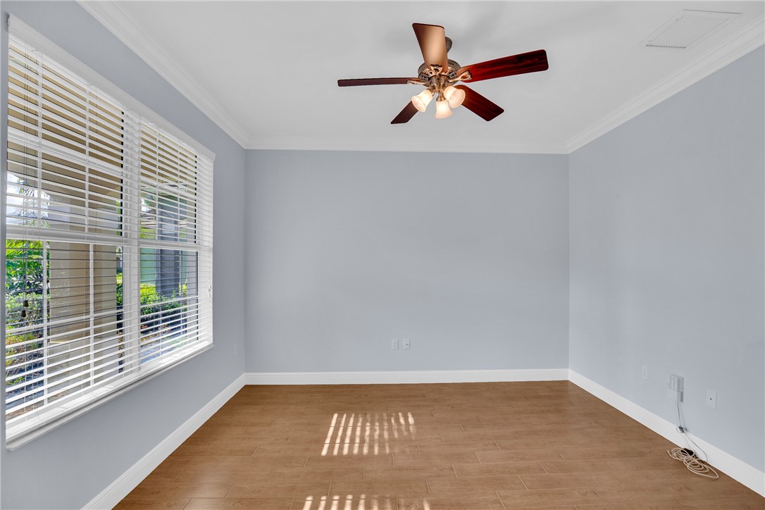 239 11th Square Southwest Vero Beach, FL 32962 - Photo 8 of 36 a view of room with window and ceiling fan