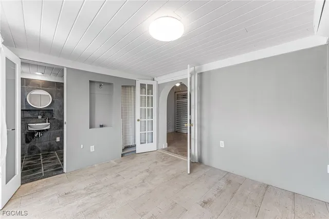 an empty room with closet area