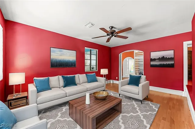 a living room with furniture and a rug