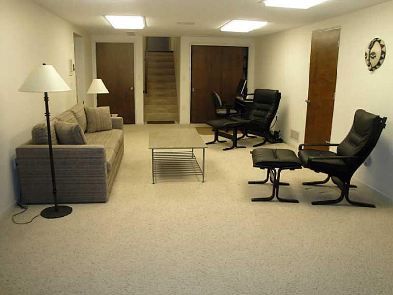4 Elmhurst Road Green Tree, PA 15220 - Photo 21 of 25 Den/Family/Great Room. The L-shaped game room has this seating area on one side and offers 3 storage closets (6X9 each). Not seen in this photo are the large furnace room and additional storage space. Stairs at the top of the photo lead to the laundry and a third full bath.