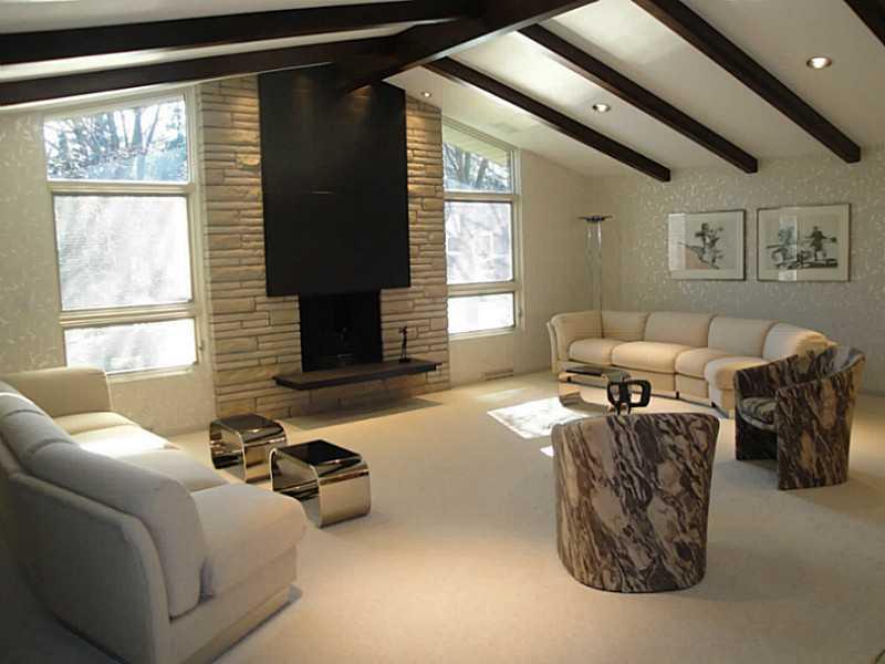 4 Elmhurst Road Green Tree, PA 15220 - Photo 5 of 25 Living Room. The living room offers a vaulted, beamed ceiling and a beautiful fireplace. It measures 24x21.