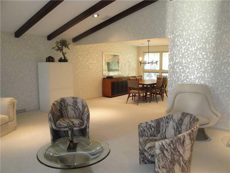 4 Elmhurst Road Green Tree, PA 15220 - Photo 7 of 25 Living Room. This view of the living room shows yet another furniture grouping as well as the flow from this space into the dining room.