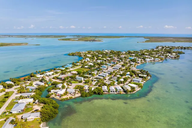 a view of a large body of water with a building in the background