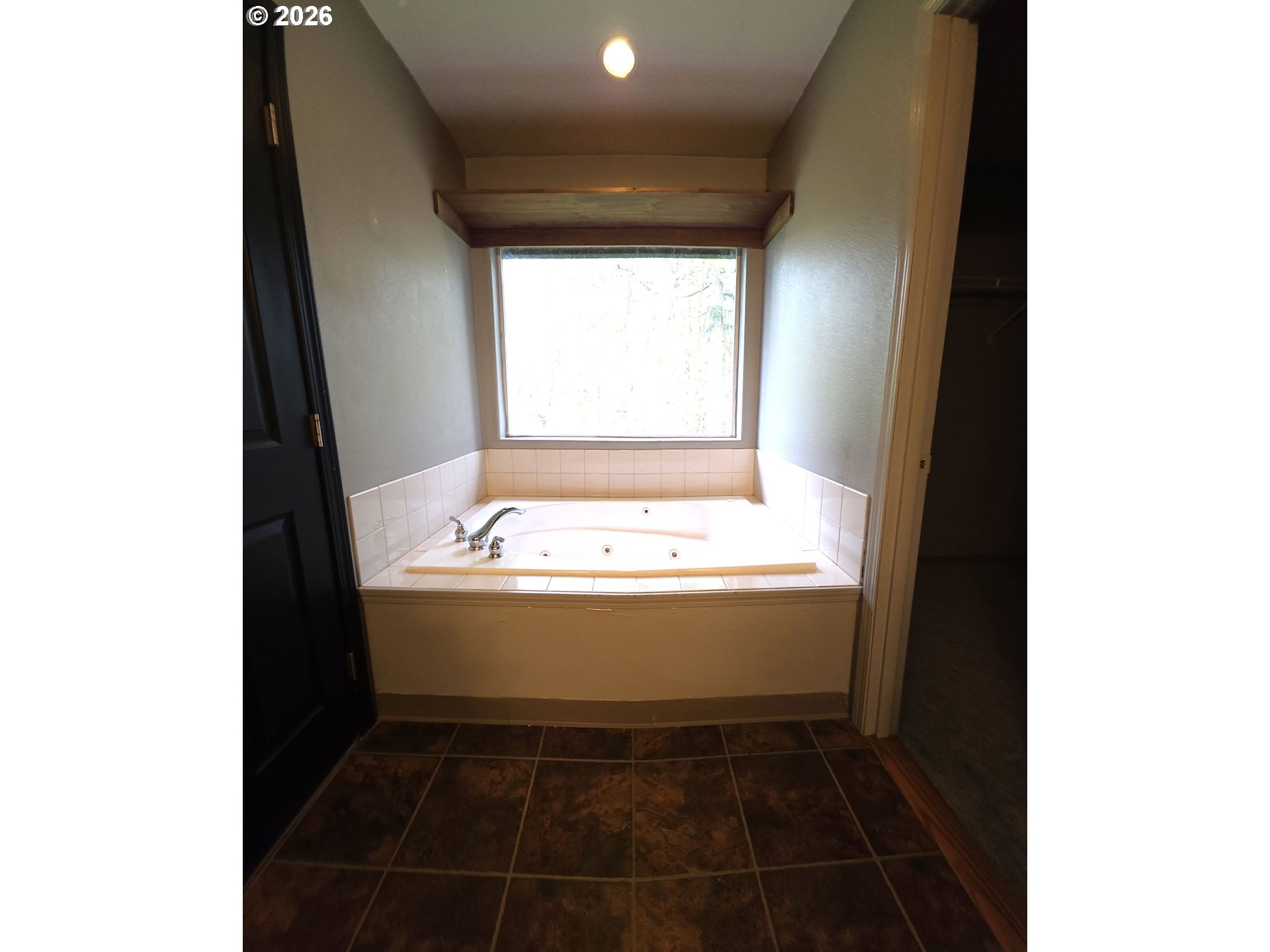 2703 Southwest 11th Street Battle Ground, WA 98604 - Photo 11 of 16 a view of bathroom with bathtub and window