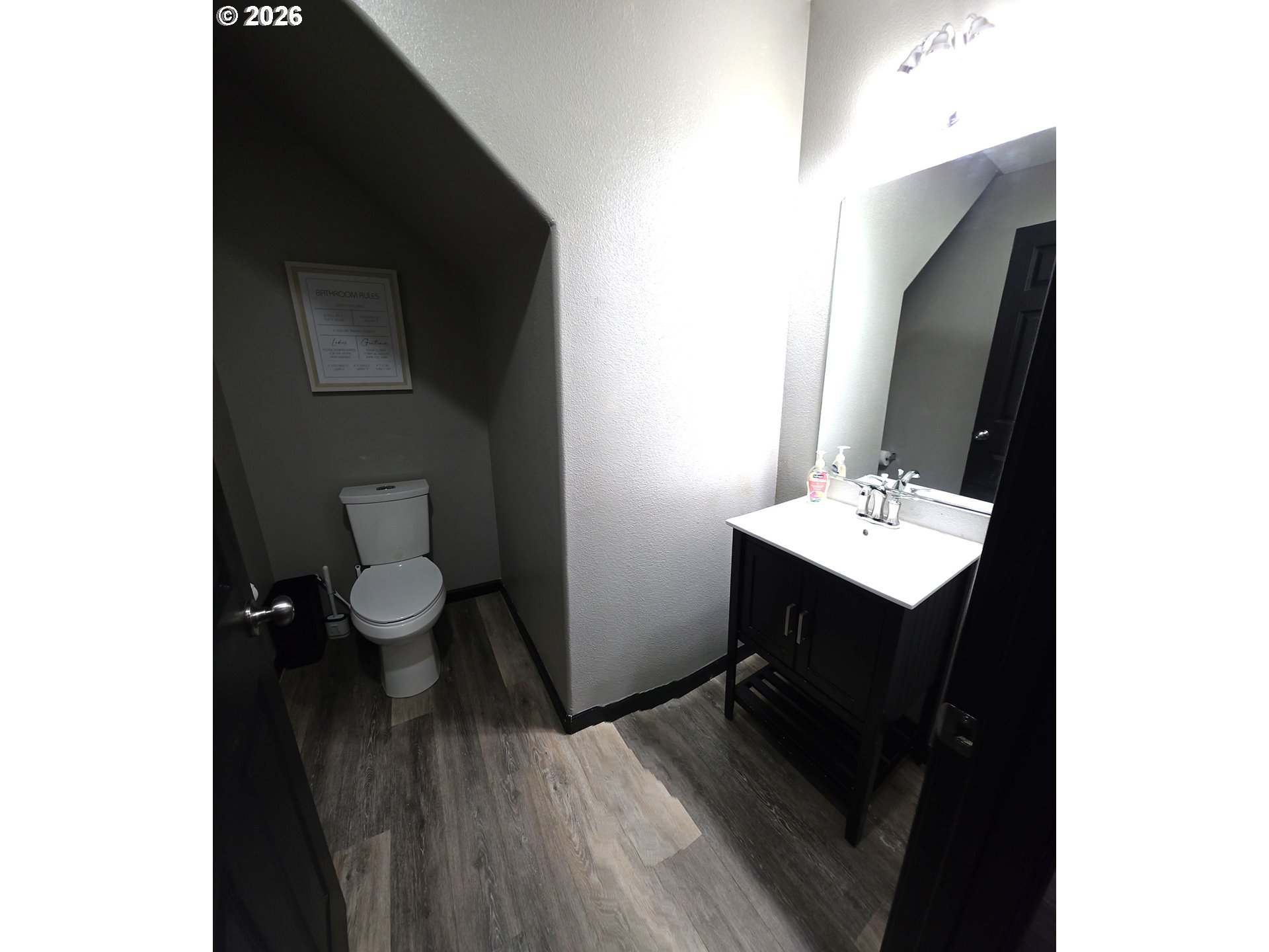 2703 Southwest 11th Street Battle Ground, WA 98604 - Photo 12 of 16 a bathroom with a sink toilet and mirror