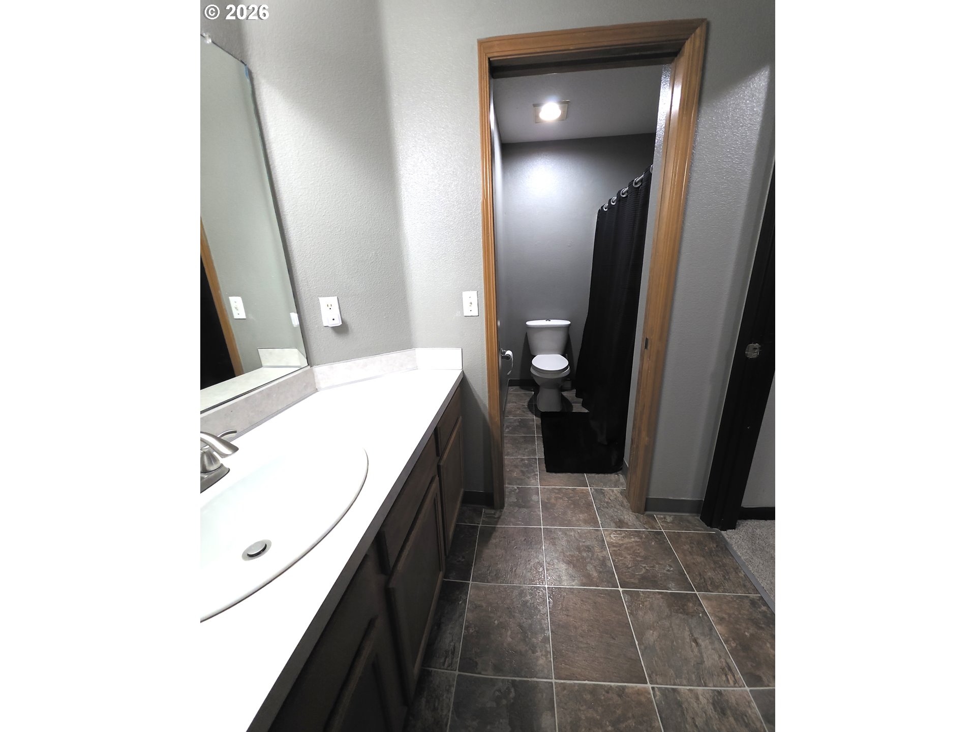 2703 Southwest 11th Street Battle Ground, WA 98604 - Photo 13 of 16 a en suite bathroom with a sink and a mirror
