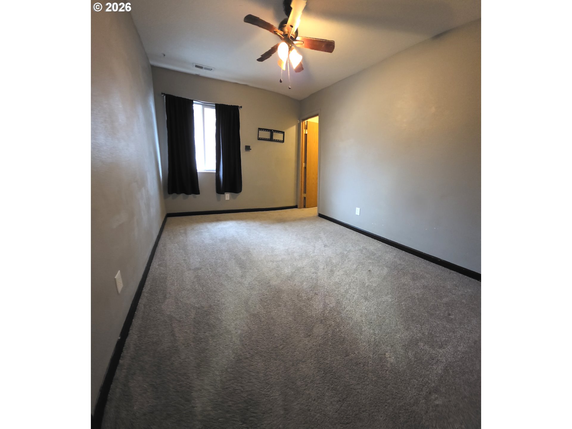 2703 Southwest 11th Street Battle Ground, WA 98604 - Photo 14 of 16 a view of a livingroom with a ceiling fan and window