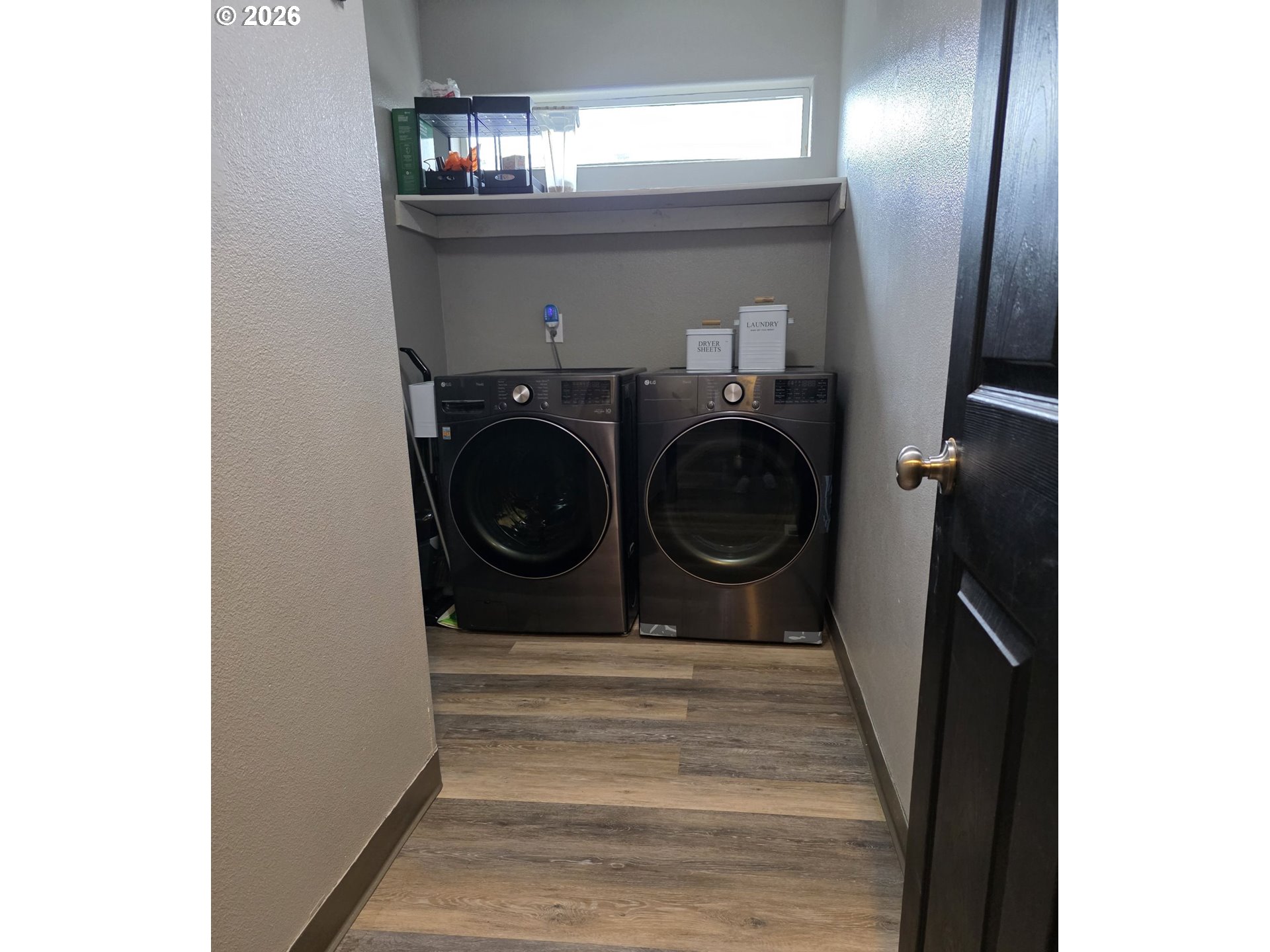 2703 Southwest 11th Street Battle Ground, WA 98604 - Photo 16 of 16 a view of a hallway with washer and dryer