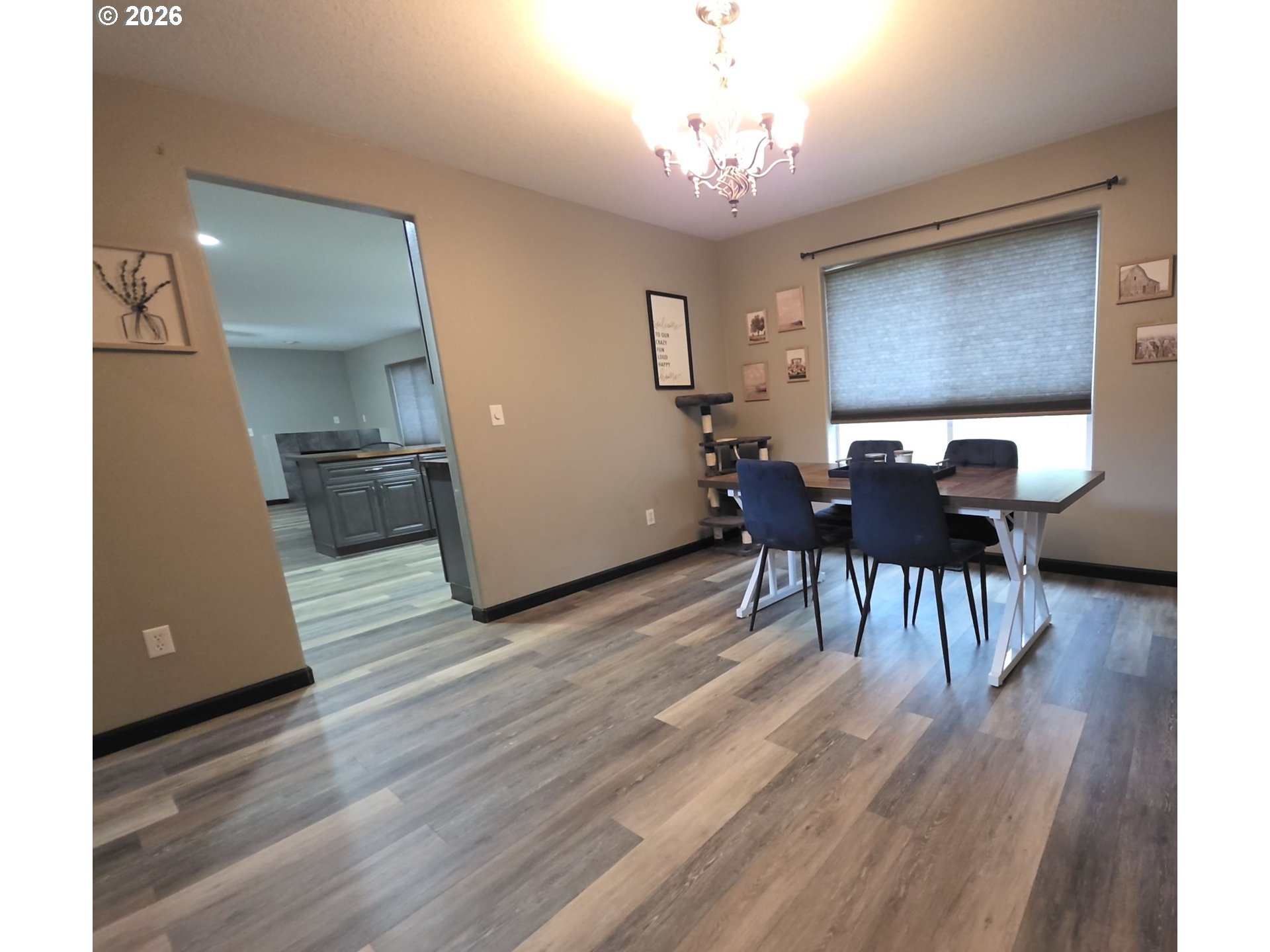 2703 Southwest 11th Street Battle Ground, WA 98604 - Photo 6 of 16 a view of a dining room with furniture window and wooden floor