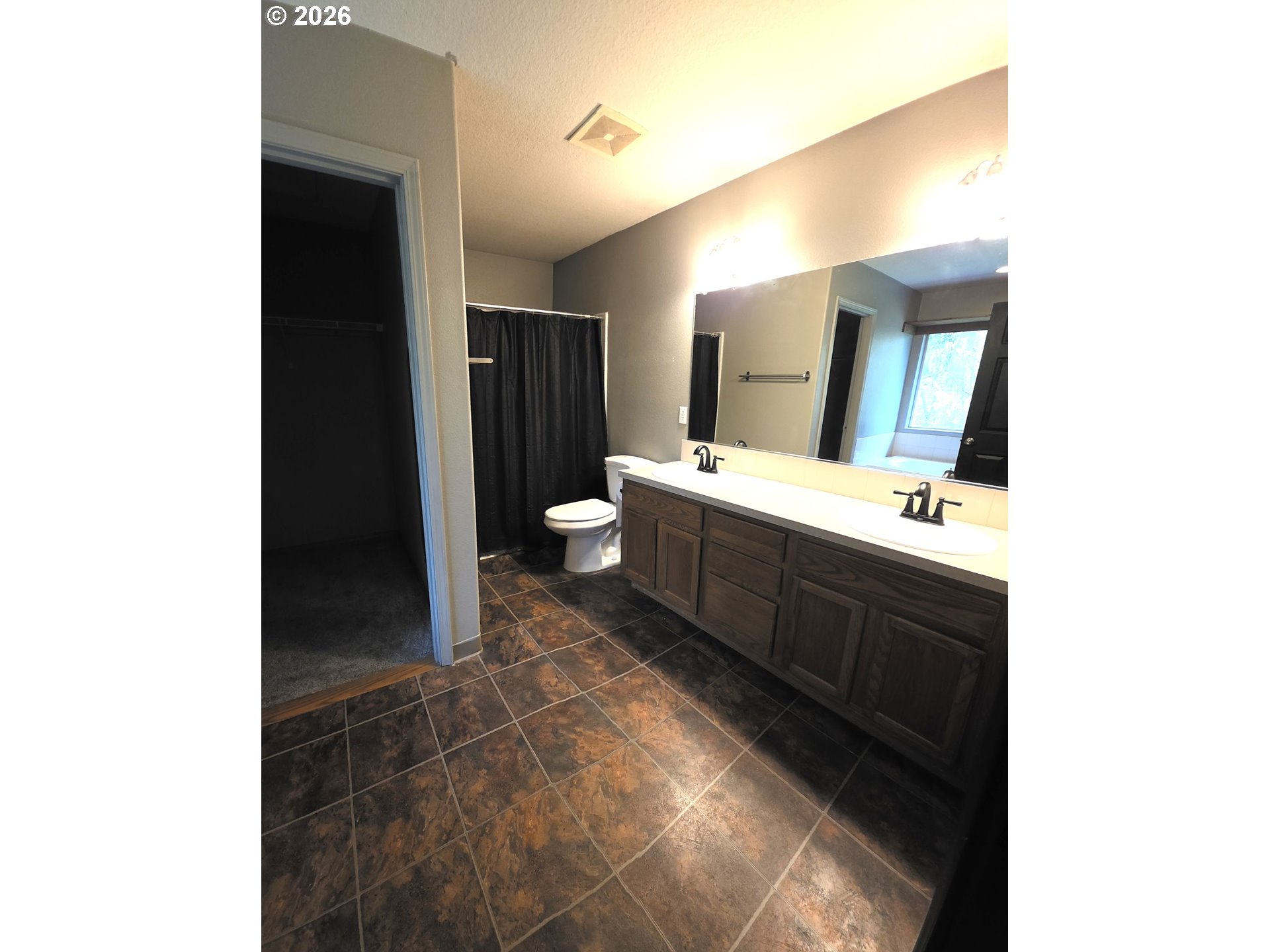 2703 Southwest 11th Street Battle Ground, WA 98604 - Photo 10 of 16 a spacious bathroom with a double vanity sink and a mirror