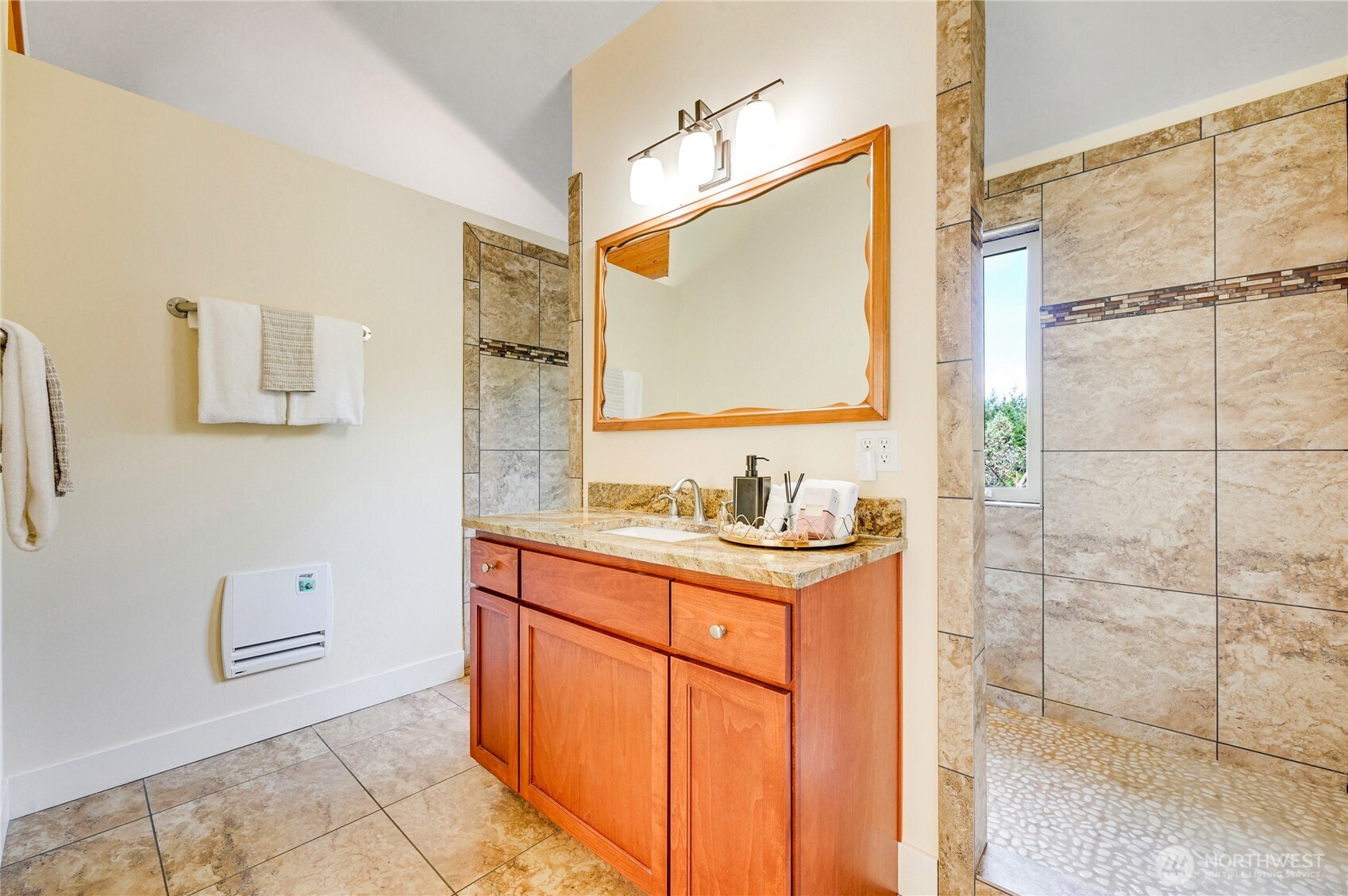 83 Octopus Court Quilcene, WA 98376 - Photo 21 of 40 a bathroom with a granite countertop sink a mirror and a