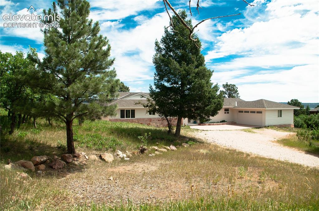 4710 Limestone Road Monument, CO 80132 - Photo 46 of 50 a view of a house with a yard
