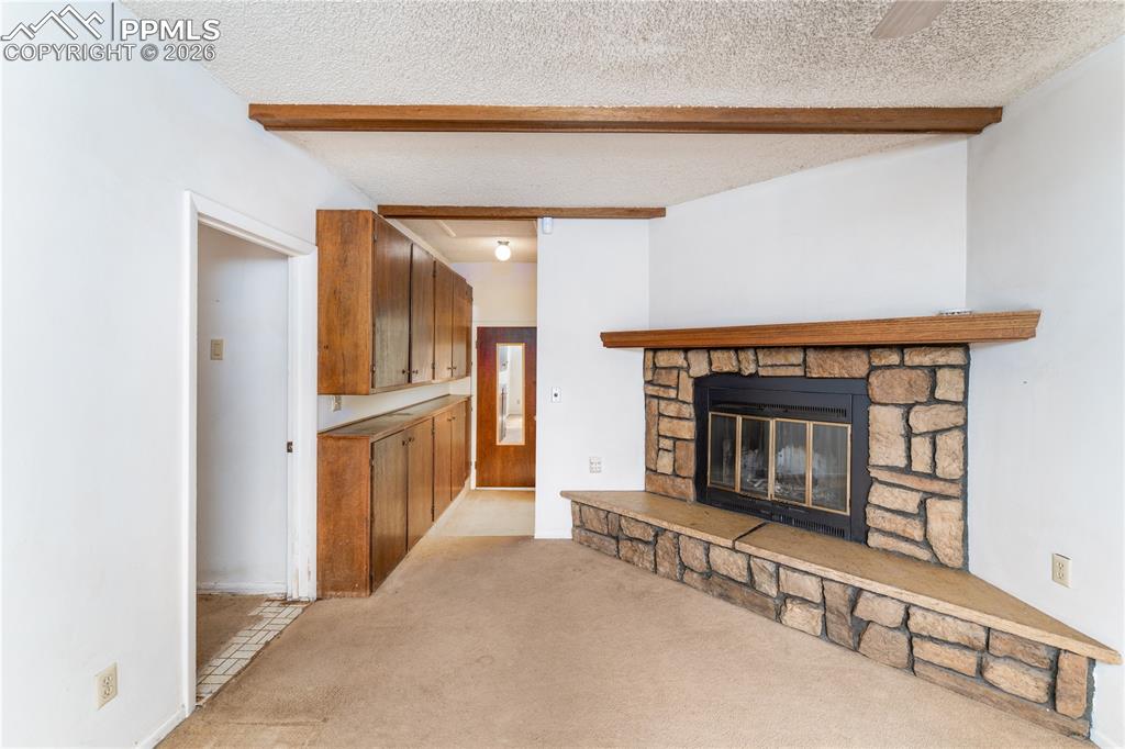 2818 Templeton Gap Road Colorado Springs, CO 80907 - Photo 10 of 27 a view of an empty room fire place and a window