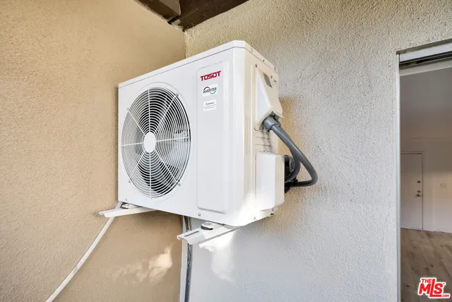 a view of a livingroom with furniture and a flat screen tv
