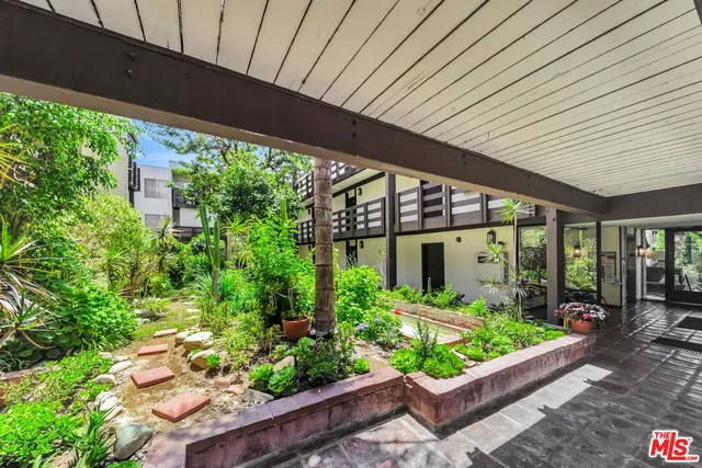 a view of a chairs and table in a patio