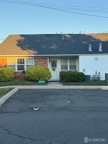 a view of a workspace with furniture and a kitchen